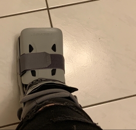aircast walking boot on a tile floor
